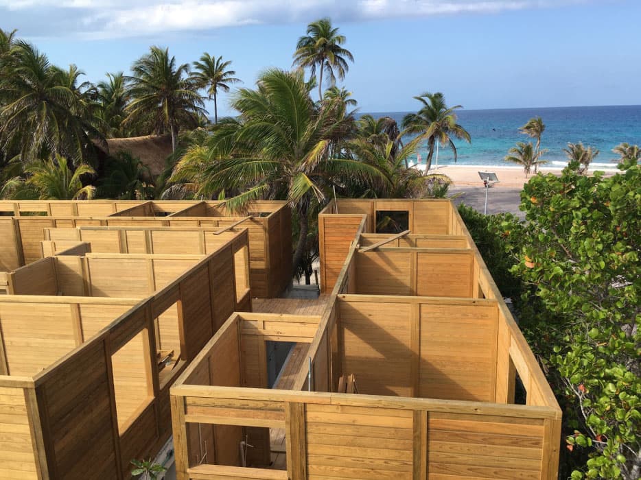 Wood-frame custom home under construction with an ocean view, Mexican Caribbean